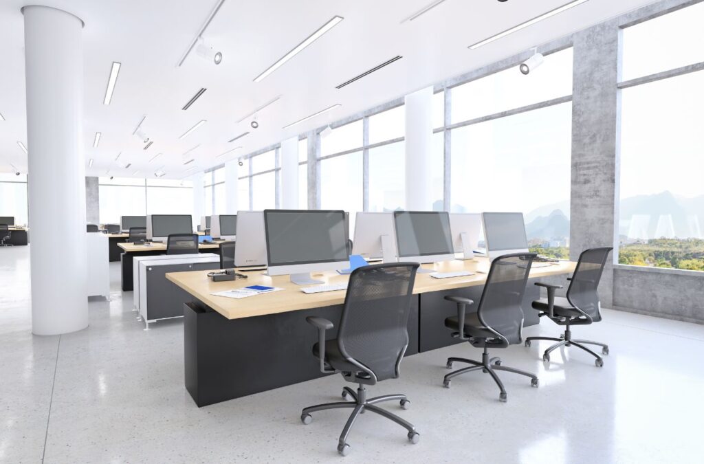 Tidy Touch employee cleaning an office space in Airdrie, delivering top-tier commercial cleaning services.